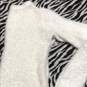 All white “furry” long sleeve shirt